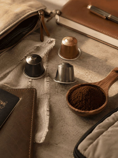 Coffee capsules and ground coffee with travel pouch and accessories for TrailBrew portable espresso maker